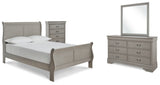 Kordasky Full Sleigh Bed with Mirrored Dresser and Chest