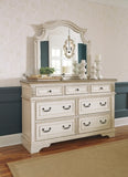 Realyn King Upholstered Panel Bed with Mirrored Dresser