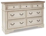 Realyn Queen Upholstered Panel Bed with Dresser