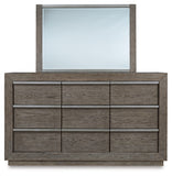 Anibecca King Upholstered Bed with Mirrored Dresser and Chest